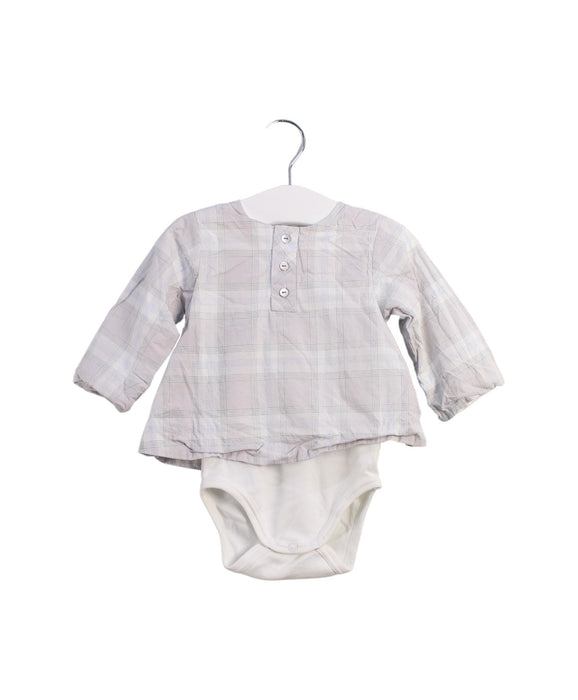 A White Long Sleeve Bodysuits from Jacadi in size 3-6M for girl. (Front View)