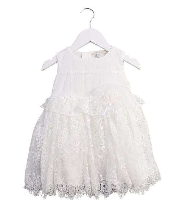 A White Sleeveless Dresses from Miniclasix in size 6-12M for girl. (Front View)