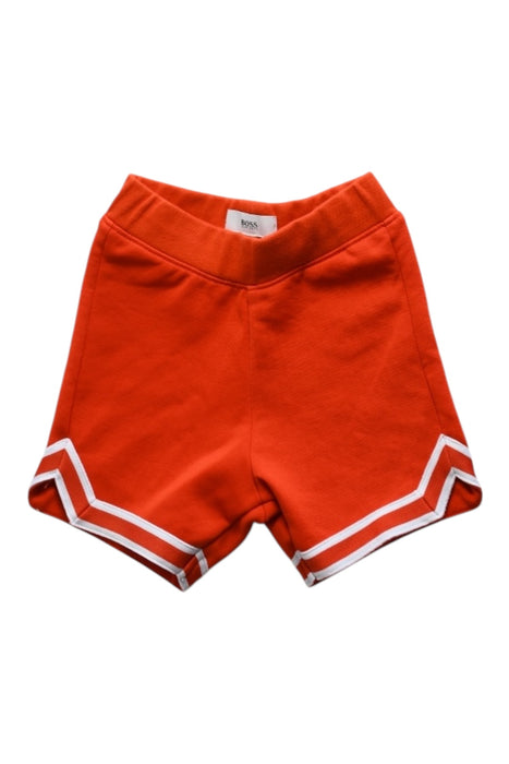 A Orange Shorts from Boss in size 6-12M for boy. (Front View)