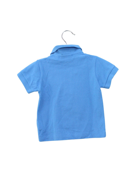 A Blue Short Sleeve Polos from Lacoste in size 6-12M for boy. (Back View)