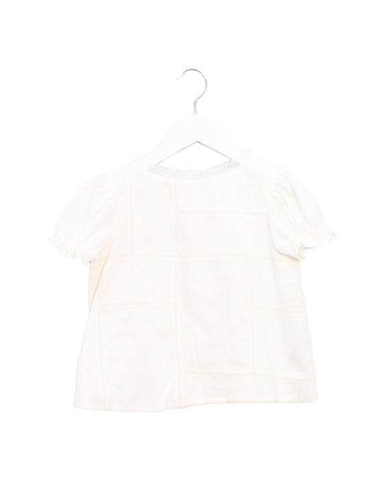 A White Short Sleeve Tops from Bonpoint in size 4T for girl. (Front View)