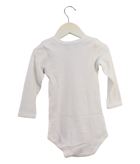 A Ivory Long Sleeve Bodysuits from Petit Bateau in size 3T for girl. (Back View)