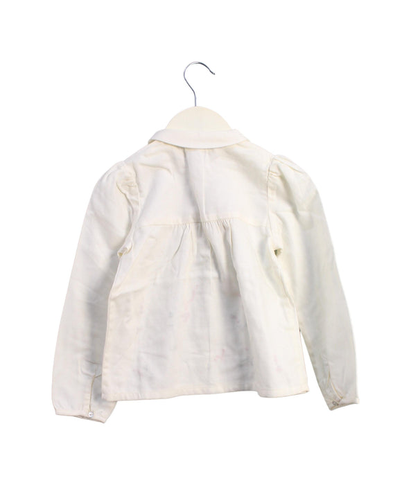 A Ivory Long Sleeve Tops from Jacadi in size 4T for girl. (Back View)
