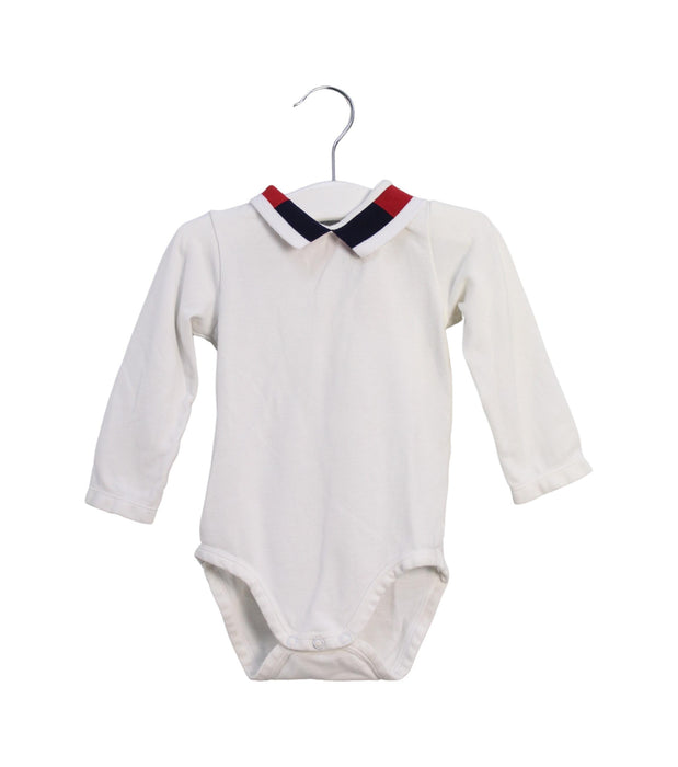 A White Long Sleeve Bodysuits from Jacadi in size 6-12M for boy. (Front View)