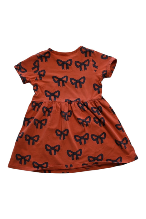 A Orange Short Sleeve Dresses from Mini Rodini in size 5T for girl. (Front View)