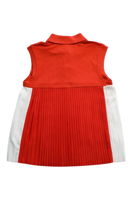 A Red Sleeveless Polos from Lacoste in size 10Y for girl. (Back View)