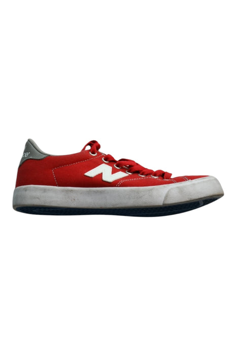 A Red Sneakers from New Balance in size 12Y for boy. (Front View)