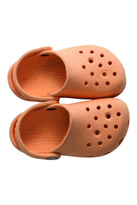 A Orange Slip Ons from Crocs in size 18-24M for girl. (Back View)