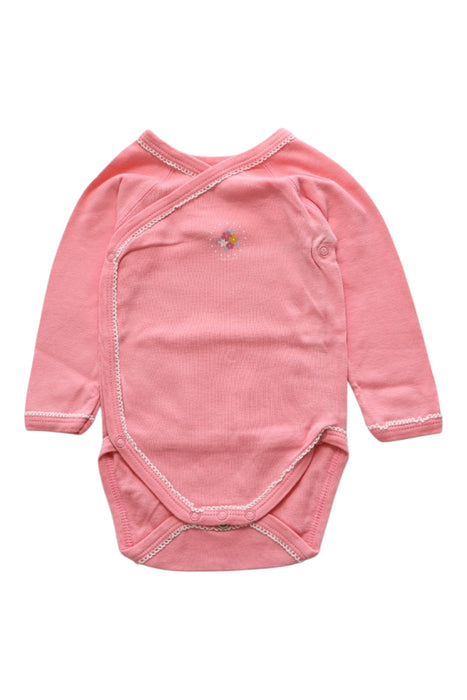 A Pink Long Sleeve Bodysuits from Petit Bateau in size 3-6M for girl. (Front View)