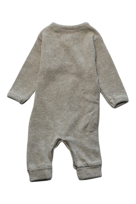 A Grey Onesies from Noppies in size Newborn for neutral. (Back View)