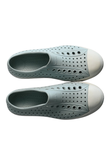 A White Sneakers from Native Shoes in size 9Y for girl. (Back View)
