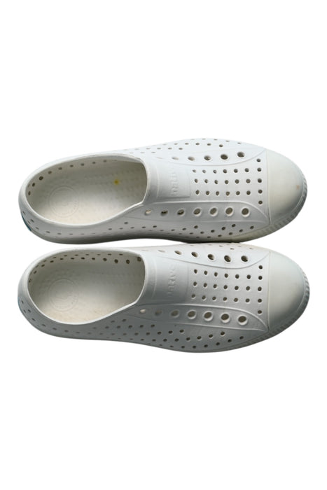 A White Slip Ons from Native Shoes in size 12Y for neutral. (Back View)