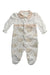 A White Long Sleeve Rompers from Mirtillo in size 6-12M for girl. (Front View)