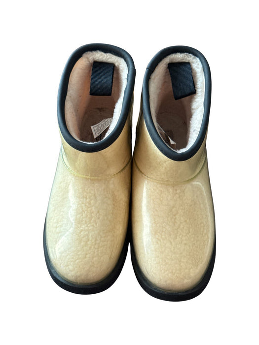 A Beige Winter Boots from UGG in size 7Y for neutral. (Front View)