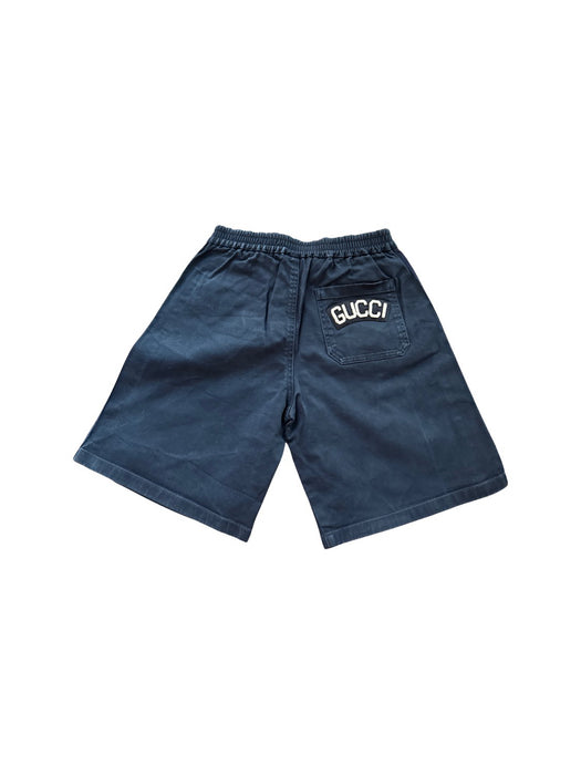 A Navy Shorts from Gucci in size 6T for boy. (Back View)