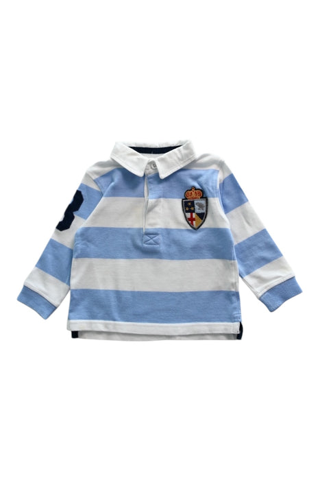 A Blue Long Sleeve Polos from Trotters in size 3-6M for boy. (Front View)
