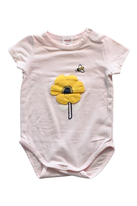 A Pink Short Sleeve Bodysuits from Seed in size 0-3M for girl. (Front View)