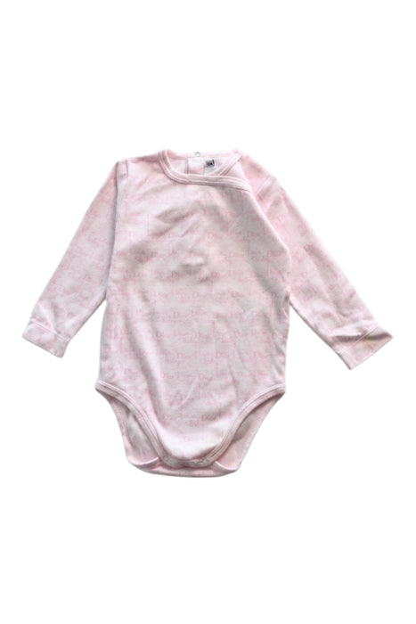 A Pink Long Sleeve Bodysuits from Dior in size 6-12M for girl. (Front View)