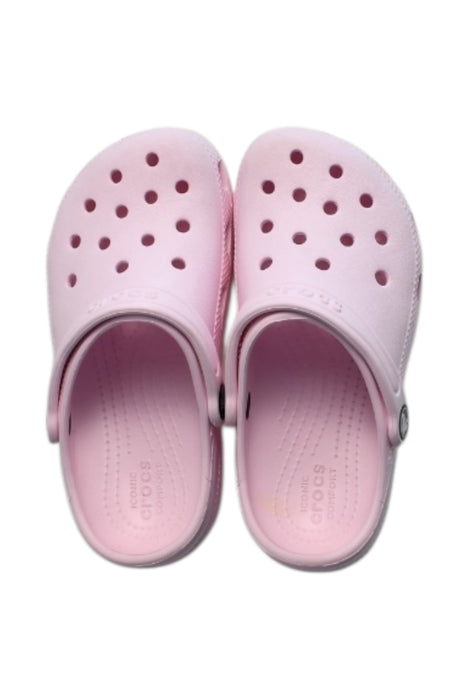 A Pink Slip Ons from Crocs in size 6T for girl. (Front View)