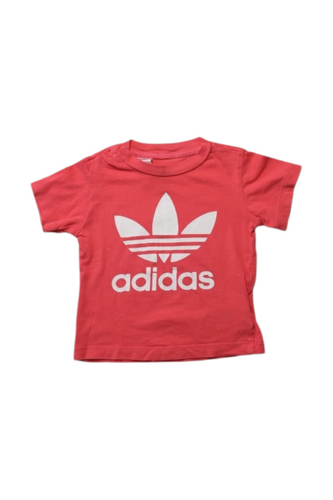 A Red Short Sleeve T Shirts from Adidas in size 12-18M for girl. (Front View)