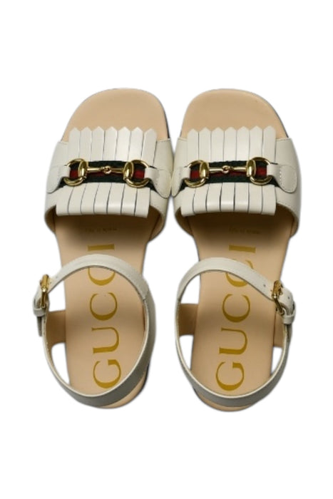 A White Sandals from Gucci in size 6T for girl. (Front View)