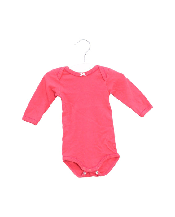 A Pink Long Sleeve Bodysuits from Petit Bateau in size 0-3M for girl. (Front View)