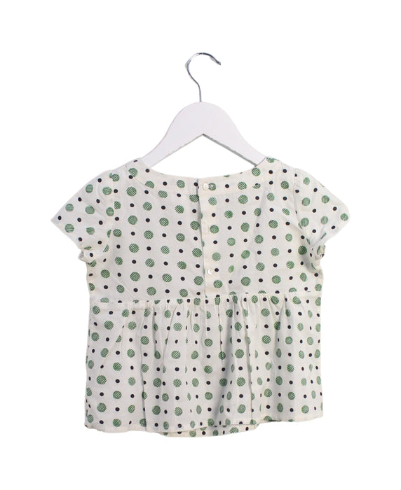 A Ivory Short Sleeve Tops from Bonpoint in size 4T for girl. (Back View)